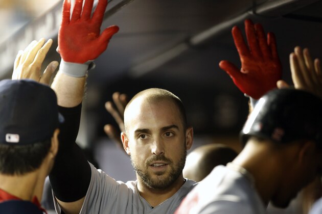 Boston Red Sox Travis Shaw celebrates with teammates in the dugout after hitting a three-run home run during the first inning of a baseball game against the New York Yankees in New York, Wednesday, Sept. 30, 2015.   (AP Photo/Kathy Willens)