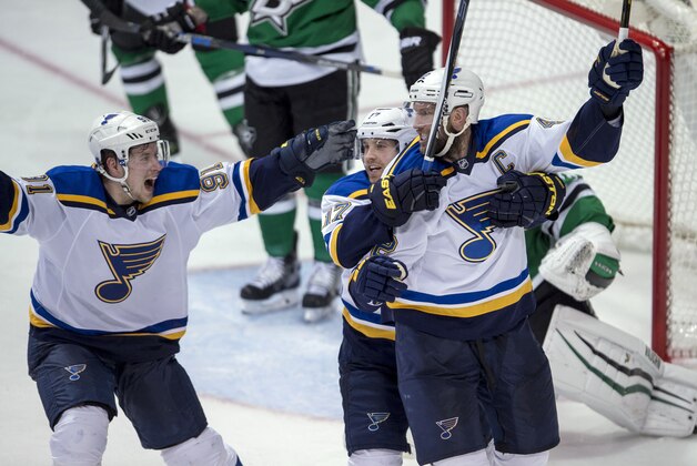 May 1, 2016; Dallas, TX, USA; St. Louis Blues center David Backes (42) and left wing Jaden Schwartz (17) and St. Louis Blues right wing Vladimir Tarasenko (91) celebrate Backes scoring the game winning goal against Dallas Stars goalie Antti Niemi (31) during the overtime period in game two of the first round of the 2016 Stanley Cup Playoffs at the American Airlines Center. The Blues win 4-3 in overtime. Mandatory Credit: Jerome Miron-USA TODAY Sports
