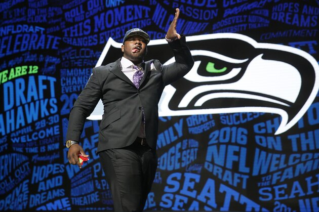 Alabama’s Jarran Reed celebrates after being selected by the Seattle Seahawks as the 49th pick in the second round of the 2016 NFL football draft, Friday, April 29, 2016, in Chicago. (AP Photo/Charles Rex Arbogast)
