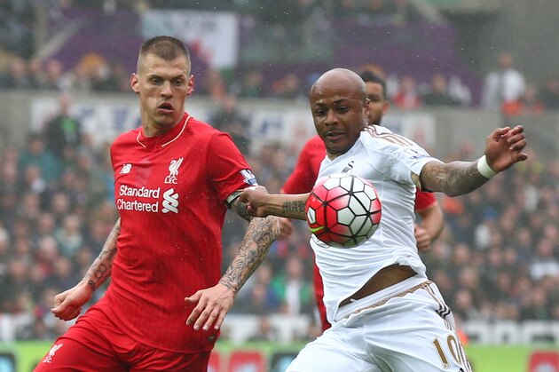 SWANSEA, WALES - MAY 01:  Andre Ayew of Swansea City is closed down by Martin Skrtel of Liverpool during the Barclays Premier League match between Swansea City and Liverpool at The Liberty Stadium on May 1, 2016 in Swansea, Wales.  (Photo by Steve Bardens/Getty Images)