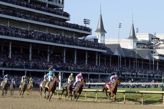 May 2, 2015; Louisville, KY, USA; Victor Espinoza aboard American Pharoah celebrates winning the 141st Kentucky Derby at Churchill Downs. Mandatory Credit: Jamie Rhodes-USA TODAY Sports