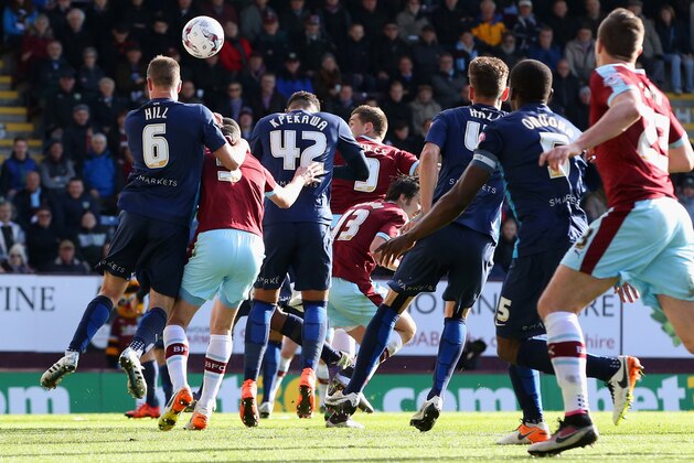 BURNLEY, UNITED KINGDOM - MAY 02:  Sam Vokes of Burnley (obscured centre) scores their first goal during the Sky Bet Championship match between Burnley and Queens Park Rangers at Turf Moor on May 2, 2016 in Burnley, United Kingdom.  (Photo by Jan Kruger/Getty Images)