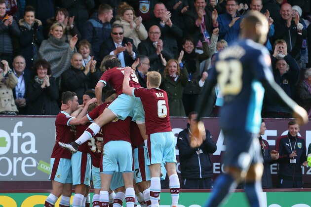 BURNLEY, UNITED KINGDOM - MAY 02:  Sam Vokes of Burnley (obscured) celebrates with team mates as he scores their first goal during the Sky Bet Championship match between Burnley and Queens Park Rangers at Turf Moor on May 2, 2016 in Burnley, United Kingdom.  (Photo by Jan Kruger/Getty Images)
