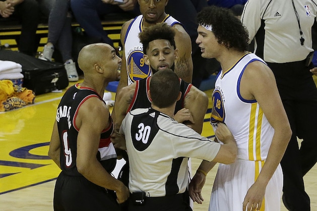Referee John Goble (30) separates Portland Trail Blazers guard Gerald Henderson, left, and Golden State Warriors forward Anderson Varejao during the second half in Game 1 of a second-round NBA basketball playoff series in Oakland, Calif., Sunday, May 1, 2016. The Warriors won 118-106. (AP Photo/Jeff Chiu)