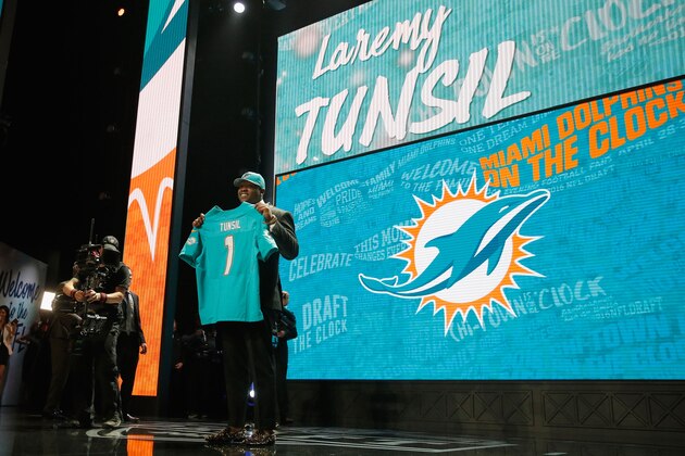 CHICAGO, IL - APRIL 28:  Laremy Tunsil of Ole Miss holds up a jersey after being picked #13 overall by the Miami Dolphins during the first round of the 2016 NFL Draft at the Auditorium Theatre of Roosevelt University on April 28, 2016 in Chicago, Illinois.  (Photo by Jon Durr/Getty Images)