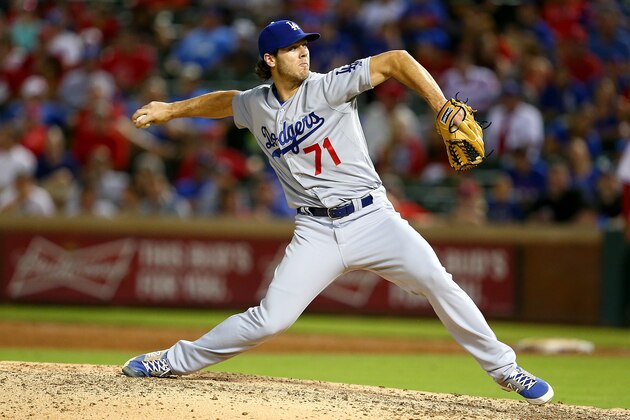 ARLINGTON, TX - JUNE 16: Josh Ravin #71 of the Los Angeles Dodgers pitches in the ninth inning during a game against the Texas Rangers at Globe Life Park in Arlington on June 16, 2015 in Arlington, Texas. The Texas Rangers defeated the Los Angeles Dodgers 3-2.  (Photo by Sarah Crabill/Getty Images)