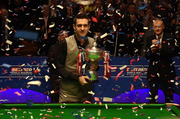 England's Mark Selby poses with the trophy after beating China's Ding Junhui in the final of the World Snooker Championship at the Crucible theatre in Sheffield, northern England, on May 2, 2016. / AFP / PAUL ELLIS        (Photo credit should read PAUL ELLIS/AFP/Getty Images)