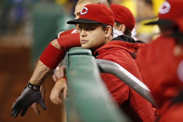 Cincinnati Reds' Devin Mesoraco watches from the dugout during the ninth inning of a baseball game against the Pittsburgh Pirates in Pittsburgh, Saturday, April 30, 2016. The Pirates won 5-1. (AP Photo/Gene J. Puskar)