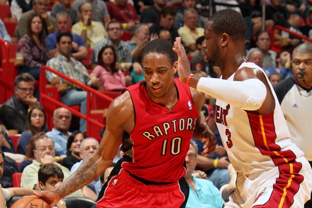 MIAMI, FL - JANUARY 5:  DeMar DeRozan #10 of the Toronto Raptors handles the ball against Dwyane Wade #3 of the Miami Heat at the American Airlines Arena in Miami, Florida on Jan. 5, 2014. NOTE TO USER: User expressly acknowledges and agrees that, by downloading and/or using this photograph, user is consenting to the terms and conditions of the Getty Images License Agreement. Mandatory copyright notice: Copyright NBAE 2014 (Photo by Issac Baldizon/NBAE via Getty Images)