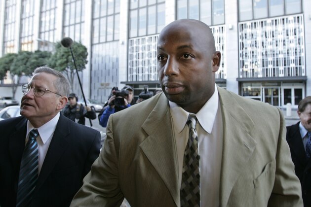 Former NFL football player Dana Stubblefield, front, leaves a federal courthouse with his attorney Mike Armstrong, left, in San Francisco, Friday, Jan. 18, 2008. Stubblefield pleaded guilty Friday to lying to investigators in the BALCO steroids case, making him the first football player charged in the long-running federal investigation. (AP Photo/Paul Sakuma)