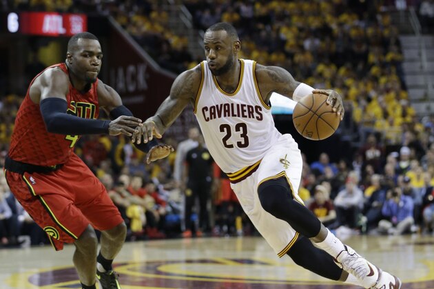 Cleveland Cavaliers' LeBron James (23) drives on Atlanta Hawks' Paul Millsap (4) in the second half in Game 1 of a second-round NBA basketball playoff series, Monday, May 2, 2016, in Cleveland. (AP Photo/Tony Dejak)