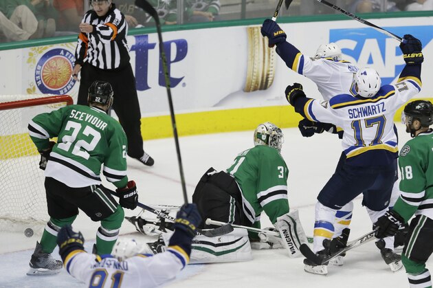 St. Louis Blues center David Backes (42) starts to celebrates his goal with teammates Jaden Schwartz (17) as Dallas Stars goalie Antti Niemi (31), Colton Sceviour (22) and Vernon Fiddler (38) look on during overtime of Game 2 of the NHL hockey Stanley Cup Western Conference semifinals Sunday, May 1, 2016, in Dallas. (AP Photo/LM Otero)