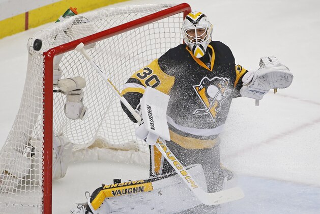 Pittsburgh Penguins goalie Matt Murray (30) deflects a puck over the net during the first period of Game 3 against the Washington Capitals in an NHL hockey Stanley Cup Eastern Conference semifinals in Pittsburgh, Monday, May 2, 2016. (AP Photo/Gene J. Puskar)