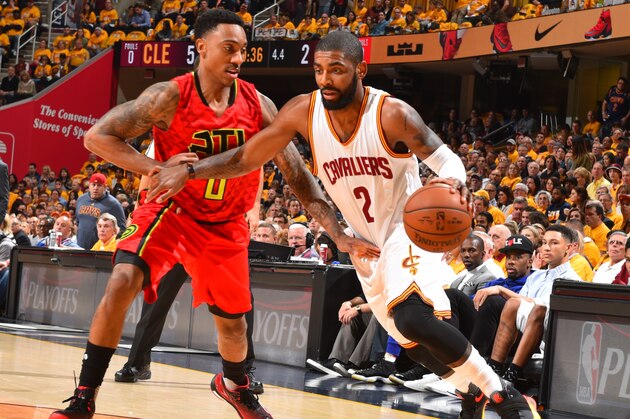 CLEVELAND,OH :  Kyrie Irving #2 of the Cleveland Cavaliers drives to the basket against the Atlanta Hawks during the Eastern Conference Semifinals Game One on May 2, 2016 at The Quicken Loans Arena in Cleveland, Ohio. NOTE TO USER: User expressly acknowledges and agrees that, by downloading and/or using this Photograph, user is consenting to the terms and conditions of the Getty Images License Agreement. Mandatory Copyright Notice: Copyright 2016 NBAE (Photo by Jesse D. Garrabrant/NBAE via Getty Images)
