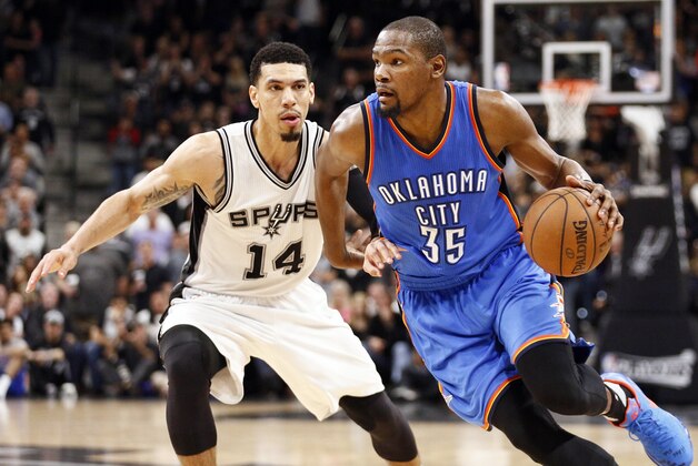 May 2, 2016; San Antonio, TX, USA; Oklahoma City Thunder small forward Kevin Durant (35) dribbles the ball as San Antonio Spurs shooting guard Danny Green (14) defends in game two of the second round of the NBA Playoffs at AT&T Center. Mandatory Credit: Soobum Im-USA TODAY Sports