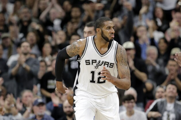 San Antonio Spurs forward LaMarcus Aldridge (12) runs up court during the first half in Game 2 of a second-round NBA basketball playoff series against the Oklahoma City Thunder on Monday, May 2, 2016, in San Antonio. (AP Photo/Eric Gay)