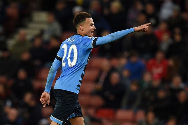 Tottenham Hotspur's English midfielder Dele Alli celebrates scoring his team's fourth goal during the English Premier League football match between Stoke City and Tottenham Hotspur at the Britannia Stadium in Stoke-on-Trent, central England on April 18, 2016. / AFP / PAUL ELLIS / RESTRICTED TO EDITORIAL USE. No use with unauthorized audio, video, data, fixture lists, club/league logos or 'live' services. Online in-match use limited to 75 images, no video emulation. No use in betting, games or single club/league/player publications.  /         (Photo credit should read PAUL ELLIS/AFP/Getty Images)