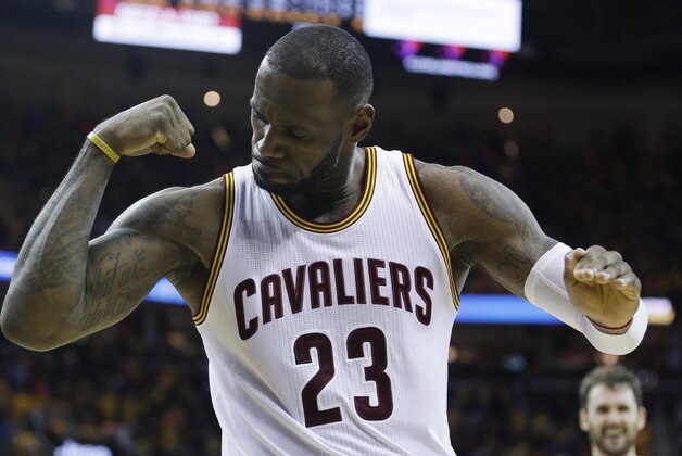 Cleveland Cavaliers' LeBron James (23) celebrates against the Atlanta Hawks in the second half in Game 1 of a second-round NBA basketball playoff series, Monday, May 2, 2016, in Cleveland. The Cavs won 104-93. (AP Photo/Tony Dejak)