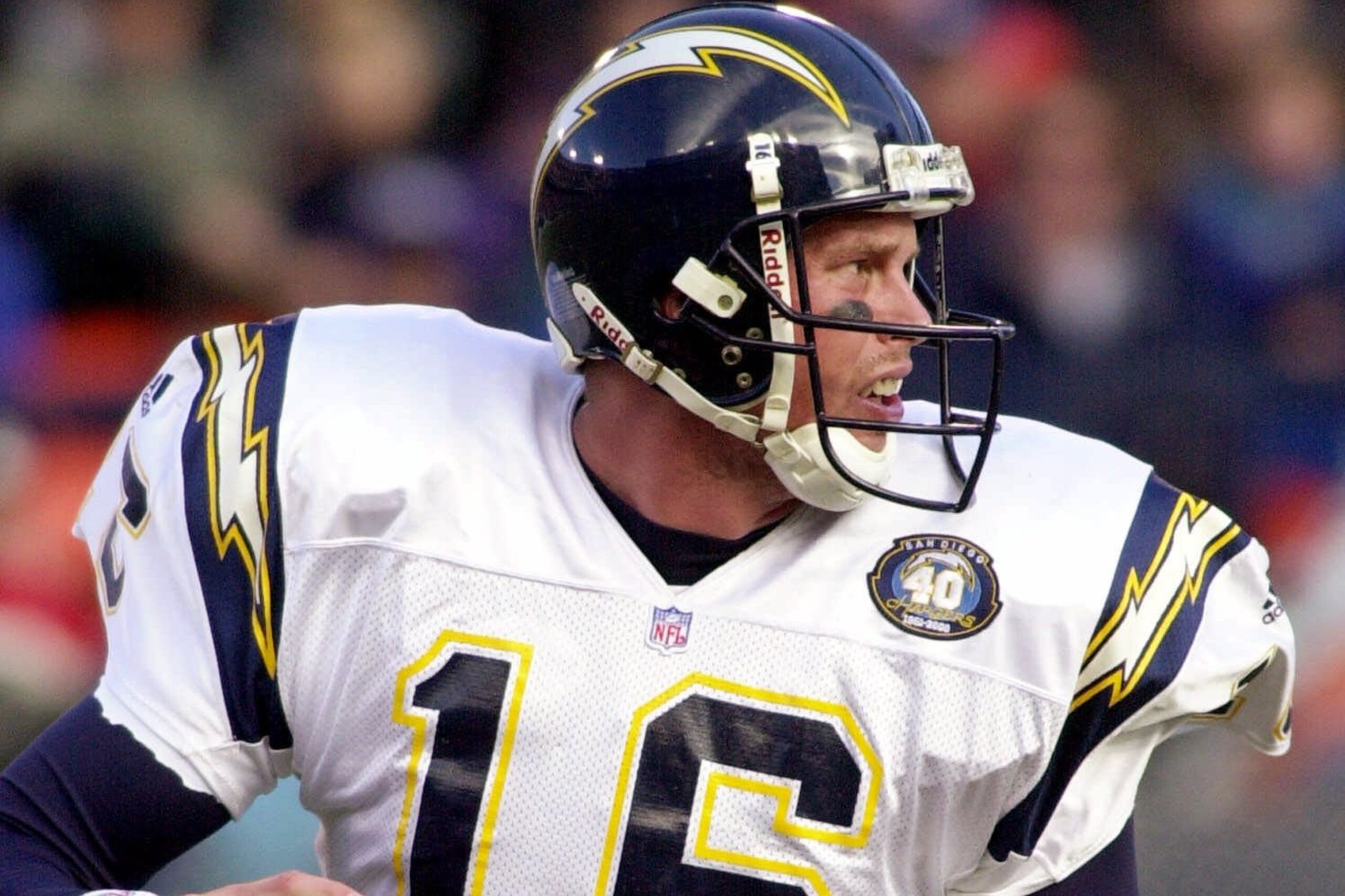 San Diego Chargers quarterback Ryan Leaf rolls out of the pocket as he looks for a receiver in the first quarter against the Denver Broncos in Denver, Sunday, Nov. 19, 2000.  Leaf passed for 311 yards in the Chargers 38-37 loss to the Broncos. (AP Photo/Kevin Higley)