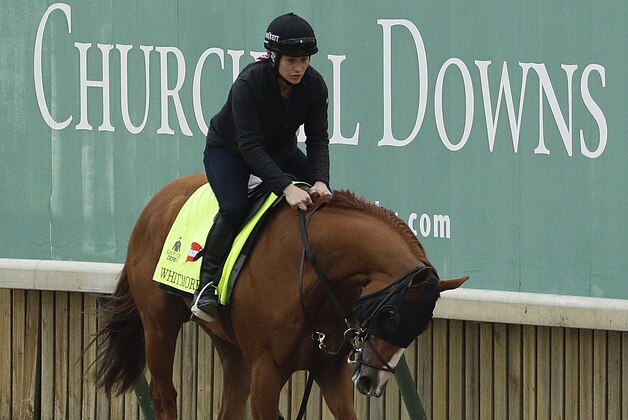 Exercise rider Laura Moquett rides Kentucky Derby hopeful Whitmore during a workout at Churchill Downs Tuesday, May 3, 2016, in Louisville, Ky. The 142nd running of the Kentucky Derby is scheduled for Saturday, May 7. (AP Photo/Charlie Riedel)