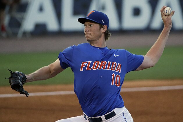 Florida pitcher A.J. Puk delivers against Arkansas during the third inning of a Southeastern Conference college baseball tournament game against Arkansas, Friday, May 22, 2015, in Hoover, Ala. (AP Photo/Brynn Anderson)
