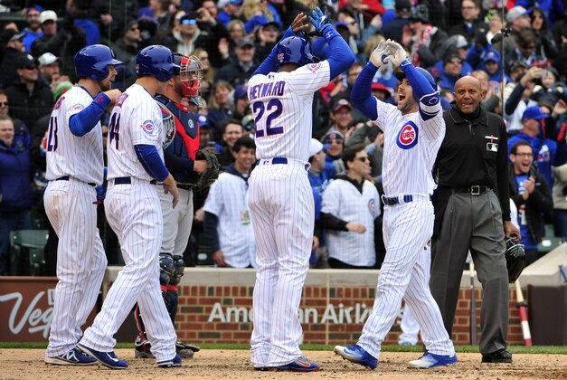 Apr 29, 2016; Chicago, IL, USA; Chicago Cubs left fielder Matt Szczur (Right) is greeted by his teammates after hitting a grand slam home run against the Atlanta Braves during the eighth inning at Wrigley Field. Mandatory Credit: David Banks-USA TODAY Sports