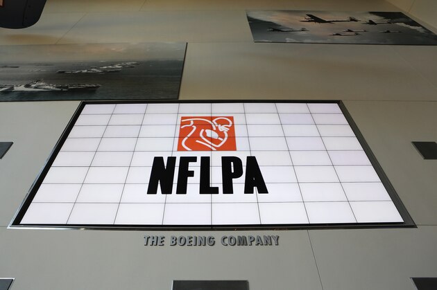 A general view of the NFLPA logo is seen on a video board during the NFLPA Legends Brunch at the National World War II Memorial Museum on Sunday February 3, 2013 in New Orleans, Louisiana. (Aaron M. Sprecher/AP Images for NFLPA)