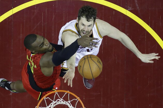 Cleveland Cavaliers' Kevin Love (0) shoots against Atlanta Hawks' Paul Millsap (4) in the second half in Game 1 of a second-round NBA basketball playoff series, Monday, May 2, 2016, in Cleveland. The Cavaliers won 104-93. (AP Photo/Tony Dejak)