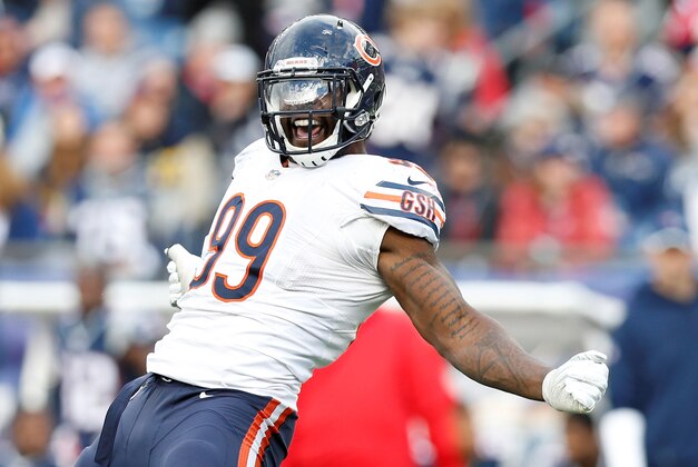 Oct 26, 2014; Foxborough, MA, USA; Chicago Bears defensive end Lamarr Houston (99) celebrates after sacking New England Patriots quarterback Jimmy Garoppolo (not pictured) during the fourth quarter at Gillette Stadium.  The Patriots won 51-23.  Mandatory Credit: Greg M. Cooper-USA TODAY Sports