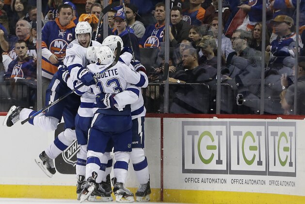 The Tampa Bay Lightning celebrate the game-winning goal by center Brian Boyle against the New York Islanders during the overtime period of Game 3 of the NHL hockey Stanley Cup Eastern Conference semifinals, Tuesday, May 3, 2016, in New York. The Lightning won 5-4. (AP Photo/Frank Franklin II)