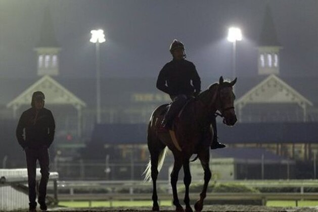 A horse is ridden back to the barn after an early morning workout at Churchill Downs Tuesday, May 3, 2016, in Louisville, Ky. The 142nd running of the Kentucky Derby is scheduled for Saturday, May 7. (AP Photo/Charlie Riedel)