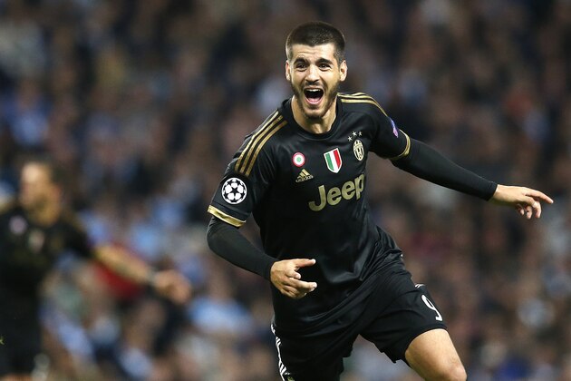 Juventus' Alvaro Morata celebrates after scoring his sides second goal during the Champions League group D soccer match between Manchester City and Juventus at the Etihad Stadium, Manchester, England, Tuesday, Sept. 15, 2015. (AP Photo/Jon Super)