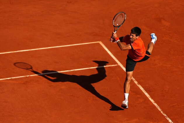 PARIS, FRANCE - JUNE 07:  Novak Djokovic of Serbia returns a shot in the Men's Singles Final against Stanislas Wawrinka of Switzerland on day fifteen of the 2015 French Open at Roland Garros on June 7, 2015 in Paris, France.  (Photo by Clive Brunskill/Getty Images)