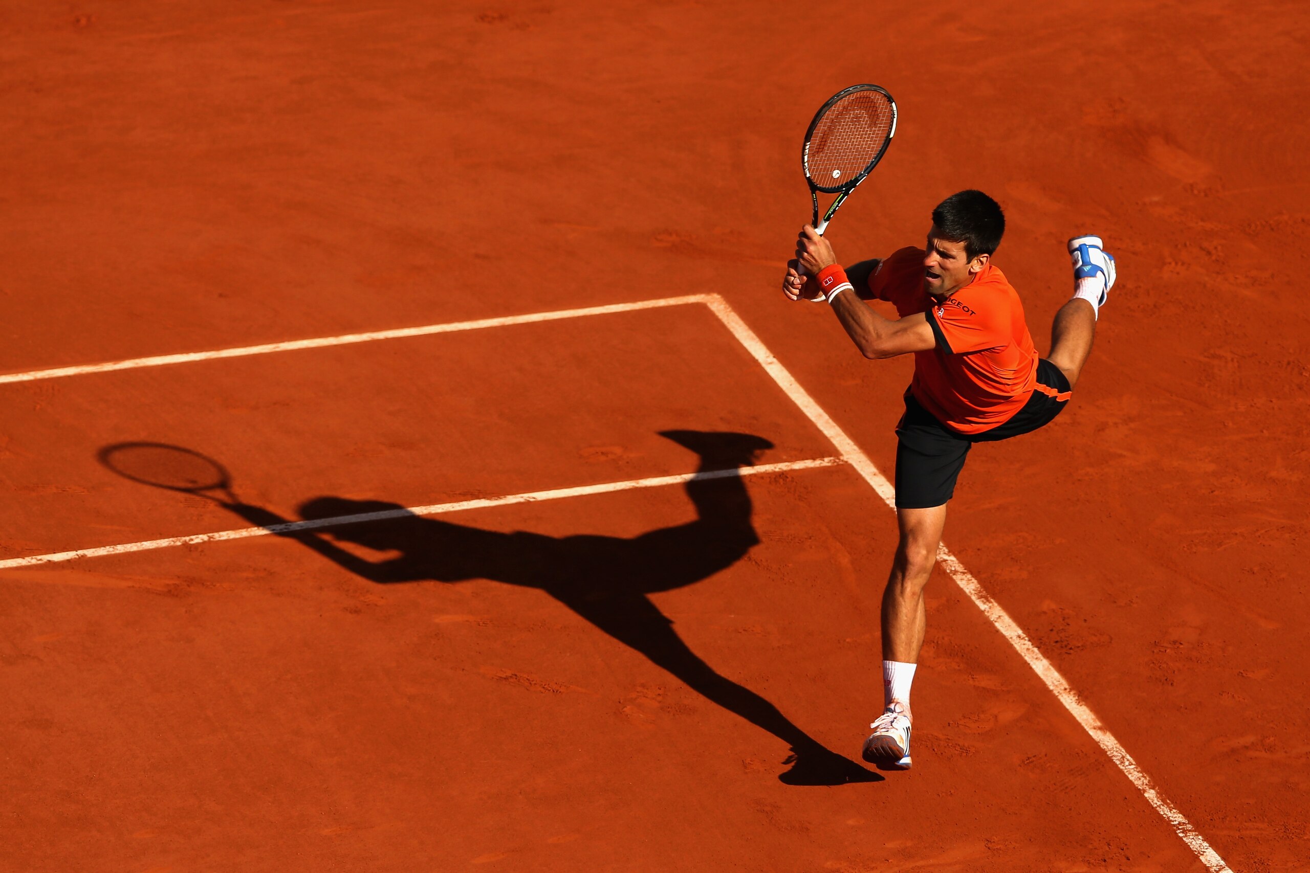 PARIS, FRANCE - JUNE 07:  Novak Djokovic of Serbia returns a shot in the Men's Singles Final against Stanislas Wawrinka of Switzerland on day fifteen of the 2015 French Open at Roland Garros on June 7, 2015 in Paris, France.  (Photo by Clive Brunskill/Getty Images)