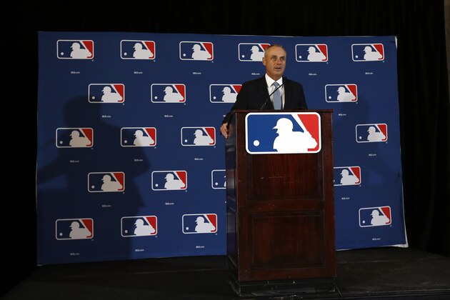 Major League Baseball Commissioner Rob Manfred answers a question during a news conference Monday, Feb. 22, 2016, in Phoenix. (AP Photo/Morry Gash)