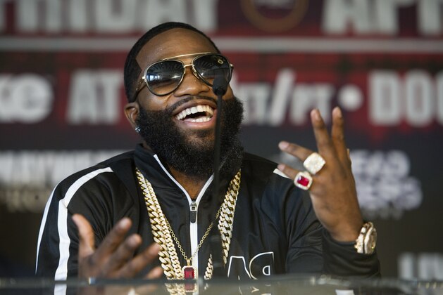 Four-division world champion Adrien Broner talks about his upcoming world title fight with Ashley Theophane, Monday, Feb. 29, 2016, during a news conference in Washington. The fight is scheduled to be held April, 1, 2016 at the D.C. Armory. (AP Photo/Cliff Owen)