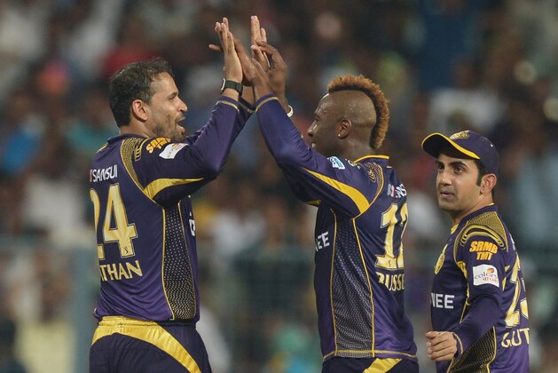 Kolkata Knight Riders Andre Russell (C) celebrates with Yusuf Pathan and Gautam Gambhir (R) after the dismissal of Kings XI Punjab Marcus Stoinis during the 2016 Indian Premier League (IPL) Twenty20 cricket match between Kolkata Knight Riders and Kings XI Punjab at the Eden Gardens Cricket Stadium in Kolkata on May 4, 2016. / AFP / Dibyangshu SARKAR / RESTRICTED TO EDITORIAL USE - STRICTLY NO COMMERCIAL USE - XGTY        (Photo credit should read DIBYANGSHU SARKAR/AFP/Getty Images)