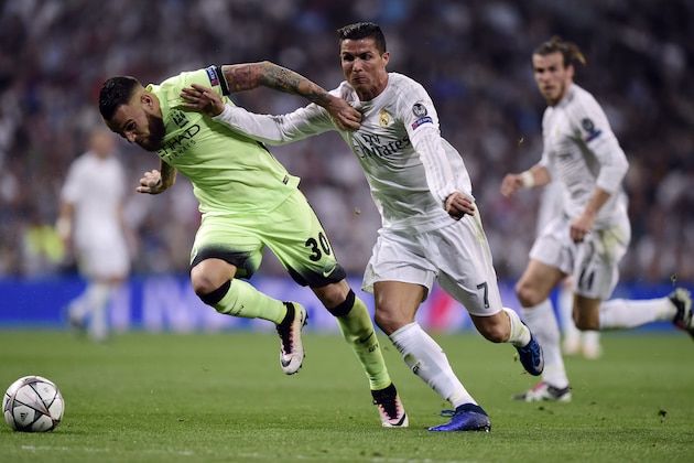 Real Madrid's Portuguese forward Cristiano Ronaldo (C) vies with Manchester City's Argentinian defender Nicolas Otamendi (L) during the UEFA Champions League semi-final second leg football match Real Madrid CF vs Manchester City FC at the Santiago Bernabeu stadium in Madrid, on May 4, 2016. / AFP / JAVIER SORIANO        (Photo credit should read JAVIER SORIANO/AFP/Getty Images)