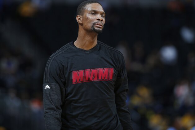 Miami Heat forward Chris Bosh (1) during the first half of an NBA basketball game Friday, Jan. 15, 2016, in Denver. (AP Photo/David Zalubowski)