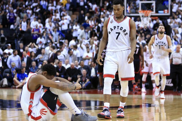 TORONTO, ON - MAY 03:  Kyle Lowry #7 of the Toronto Raptors attempts to help DeMar DeRozan #10 up off the floor late in the second half of Game One of the Eastern Conference Semifinals against the Miami Heat during the 2016 NBA Playoffs at the Air Canada Centre on May 3, 2016 in Toronto, Ontario, Canada.  NOTE TO USER: User expressly acknowledges and agrees that, by downloading and or using this photograph, User is consenting to the terms and conditions of the Getty Images License Agreement.  (Photo by Vaughn Ridley/Getty Images)