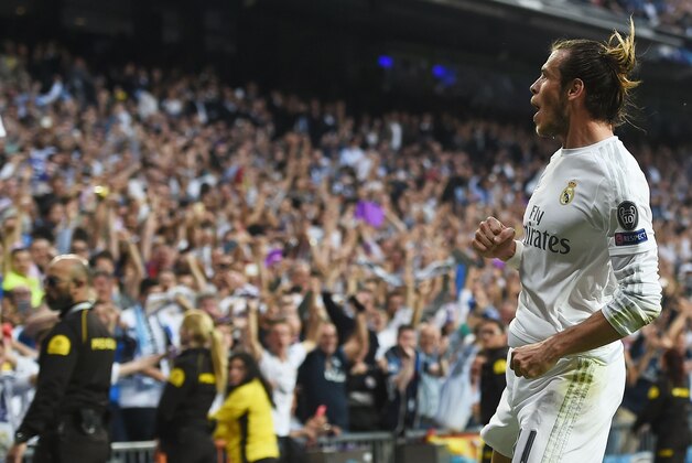 Real Madrid's Welsh forward Gareth Bale celebrates a goal during the UEFA Champions League semi-final second leg football match Real Madrid CF vs Manchester City FC at the Santiago Bernabeu stadium in Madrid, on May 4, 2016. / AFP / PAUL ELLIS        (Photo credit should read PAUL ELLIS/AFP/Getty Images)