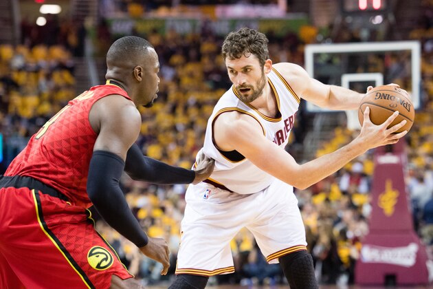 CLEVELAND, OH - MAY 2: Paul Millsap #4 of the Atlanta Hawks guards Kevin Love #0 of the Cleveland Cavaliers during the first half of the NBA Eastern Conference semifinals at Quicken Loans Arena on May 2, 2016 in Cleveland, Ohio. NOTE TO USER: User expressly acknowledges and agrees that, by downloading and or using this photograph, User is consenting to the terms and conditions of the Getty Images License Agreement. (Photo by Jason Miller/Getty Images)