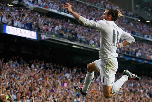Real Madrid's Gareth Bale celebrates after scoring the opening goal during the Champions League semifinal second leg soccer match between Real Madrid and Manchester City at the Santiago Bernabeu stadium in Madrid, Wednesday May 4, 2016. (AP Photo/Francisco Seco)