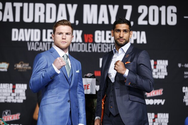 Amir Khan, right, and Canelo Alvarez pose for photographers during a news conference at the MGM Grand, Wednesday, May 4, 2016, in Las Vegas. The two are scheduled to fight in a middleweight title bout Saturday in Las Vegas. (AP Photo/John Locher)