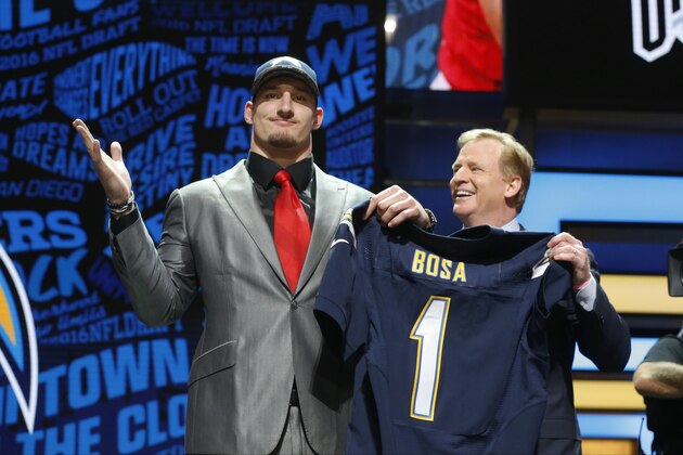 Ohio State’s Joey Bosa poses for photos with NFL commissioner Roger Goodell after being selected by the San Diego Chargers as the third pick in the first round of the 2016 NFL football draft, Thursday, April 28, 2016, in Chicago. (AP Photo/Charles Rex Arbogast)