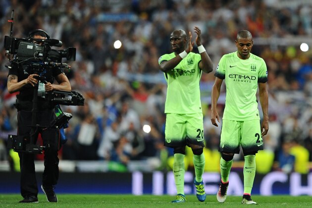 MADRID, SPAIN - MAY 04: Fernandinho of Manchester City and Eliaquim Mangala of Manchester City look dejected during the UEFA Champions League semi final, second leg match between Real Madrid and Manchester City FC at Estadio Santiago Bernabeu on May 4, 2016 in Madrid, Spain.  (Photo by David Ramos/Getty Images )