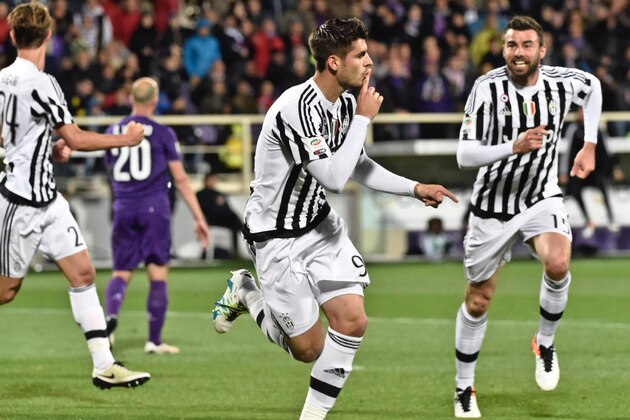 Juventus' forward Alvaro Morata, center, celebrates after he scored during a Serie A soccer match at the Artemio Franchi stadium in Florence, Italy  Sunday , April 24, 2016. (Maurizio Degl'Innocenti/ANSA via AP) ITALY OUT