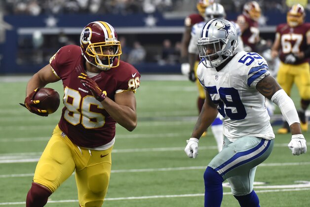 Washington Redskins tight end Jordan Reed (86) gains yardage after catching a pass as Washington Redskins linebacker Carlos Fields (59) pursues in the first half of an NFL football game, Sunday, Jan. 3, 2016, in Arlington, Texas. (AP Photo/Michael Ainsworth)