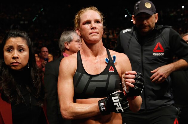 LAS VEGAS, NV - MARCH 05:  Holly Holm (black trunks) exits the Octagon after her loss to Miesha Tate in their UFC women's bantamweight championship bout during the UFC 196 event inside MGM Grand Garden Arena on March 5, 2016 in Las Vegas, Nevada.  (Photo by Christian Petersen/Zuffa LLC/Zuffa LLC via Getty Images)