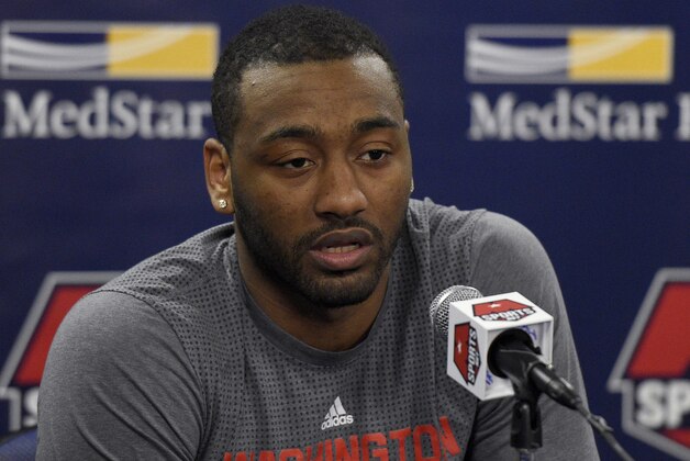 Washington Wizards guard John Wall speaks during a media availability before an NBA basketball game against the Atlanta Hawks, Wednesday, April 13, 2016, in Washington. (AP Photo/Nick Wass)